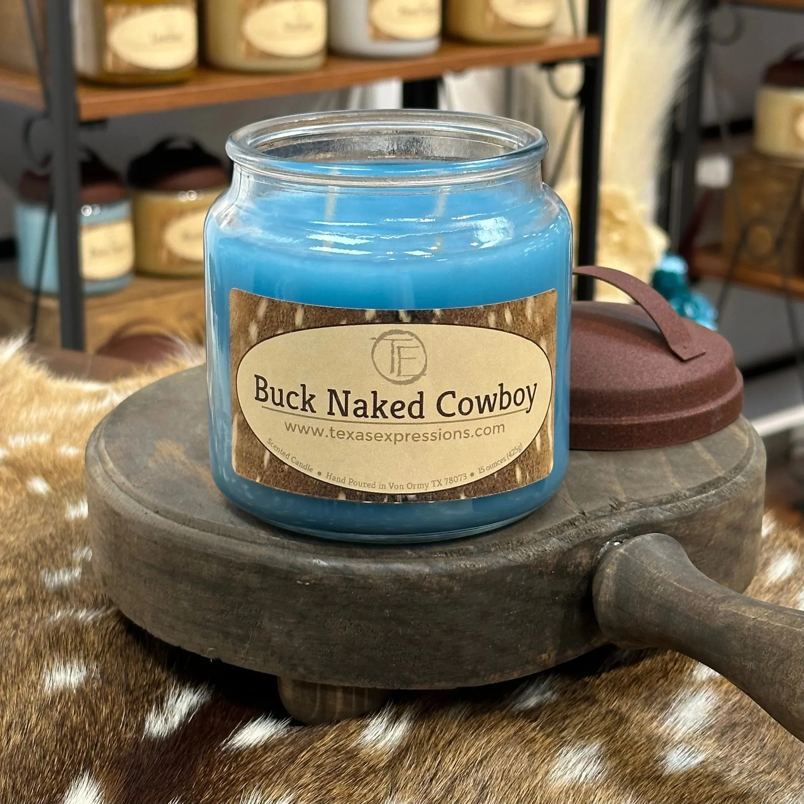 Buck Naked Cowboy Texas Expressions Candle 16 Oz